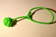 a green rope with a knot attached to it