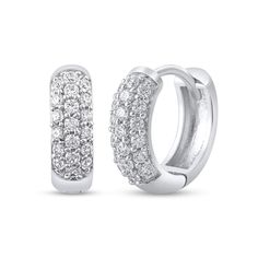 Dainty yet dazzling, these diamond hoop earrings are a modern must-have style. Fashioned in cool 10K white gold, each domed hoop shimmers with three rows of diamonds along the front edge. Radiant with 1/4 ct. t.w. of diamonds and a bright polished shine, these earrings secure with hinged backs. White Diamond Sparkling Hoop Earrings, Sparkling White Diamond Hoop Earrings, Sparkling Diamond Round Huggie Earrings, Anniversary White Gold Sparkling Huggie Earrings, Classic Sparkling White Gold Hoop Earrings, Anniversary Sparkling White Gold Huggie Earrings, Diamond Hoop Earrings, Gemstone Rings, Hoop Earrings