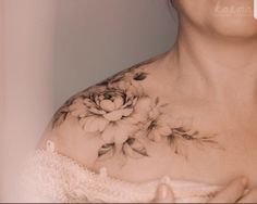 a woman's chest with flowers on it