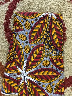 This red African Fabric is high quality African print made from 100% cotton and it's 45 inches wide. It is used for making African Clothing, African quilts, & For Home decoration. FYI: Print is Double sided. The listing is for 1, 6 yards and Headwrap Each piece of fabric measures: 36in by 45in for 1 yard 216in by 45in for 6 yards 70in by 22in for Head wrap If you purchase more than one yard, you will receive one continuous piece. *If you require more than what I have listed, feel free to sen Multicolor Batik Print Fabric For Festivals, Traditional Printed Multicolor Fabric, Multicolor Batik Print Fabric And Notions, Multicolor Batik Print Fabric Patterns, Patterned Batik Print Fabric, Patterned Batik Print Cotton Fabric, Batik Print Cotton Fabric With Pattern, Patterned Cotton Fabric With Batik Print, Printed Multicolor Ankara Fabric