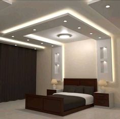 a modern bedroom with white walls and lights on the ceiling, along with a large bed