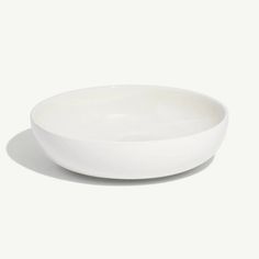 a white bowl sitting on top of a table