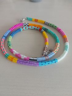 multicolored beaded bracelets on a table