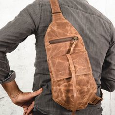 This Vegan Men Sling Bag is designed with simple lines, Simple,so comfortable and so good looking, you will not want to take it off it has a zippered back pocket and an inner pocket to hold all your valuables. With magnetic clasps on the hood flaps and an adjustable metal buckle on the strap, this one strap backpack is super comfy and perfect for every day use. Stainless steel fastener. Plated all silver color hard-ewer grommets. This bag is made from Wax canvas to be used hard, and allowed to a Practical Chest Bag With Zipper For Daily Use, Practical Chest Bag For Daily Use, Everyday Chest Bag With Anti-theft Pocket, Everyday Anti-theft Shoulder Chest Bag, Everyday Anti-theft Chest Shoulder Bag, Everyday Carry Chest Shoulder Bag With Pockets, Casual Shoulder Bag For Everyday Carry, Practical Everyday Bag With Anti-theft Pocket, Brown Chest Bag With Anti-theft Pocket For Everyday Use