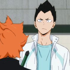 an anime character with red hair talking to another person in front of him, who is wearing a white jacket