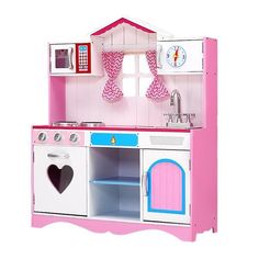 a pink and white kitchen playset with sink, stove, oven and microwave in it