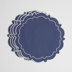 blue paper with white scalloped edges