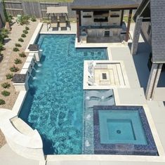 an aerial view of a pool and patio area