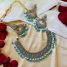 Aarohi Firozi Sky Blue Golden Polki Necklace Set with maangtikka. Expertly crafted, the Aarohi Firozi Sky Blue Golden Polki Necklace Set with maangtikka features exquisite detailing and elegance. The sky blue and golden tones complement each other, creating a stunning piece perfect for any occasion. Elevate your look with this timeless set. Desi Jewelry, Indian Jewelry Set, Polki Necklace Set, Necklace Set Indian, Wedding Jewelry Set, Polki Necklace, Indian Jewelry Sets, Wedding Jewelry Sets, Indian Jewelry