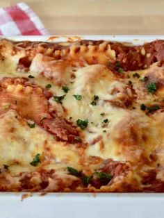 a casserole dish filled with meat and cheese