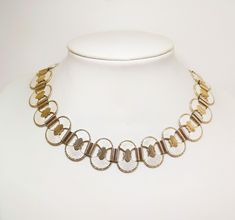 This Norwegian vintage necklace from the late 1940s to 1950s, crafted by Jensen & Aamodt, exudes timeless elegance and historical charm. Meticulously designed, it features delicate white guilloche enamel adorning sterling silver, showcasing the meticulous craftsmanship of its creators. Reflecting the resurgence of ancient Egyptian motifs during its era, the necklace pays homage to the enigmatic beauty of Nefertiti, queen of Pharaoh Akhenaten, through a captivating pendant centerpiece. Measuring Egyptian Motifs, Enamel Necklaces, Ancient Civilizations, Ancient Egyptian, Makers Mark, Vintage Necklace, Timeless Elegance, Chains Necklace, Jewelry Necklaces