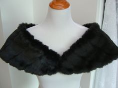 "I made this shoulder shrug out of black mink faux fur and lined the wrap with black fleece for warmth and comfort. The shawl is 43\" long on the upper cut, cut on a curve for a better fit, and 8\" wide(long) at the back. You can pin in place or add your own special piece of pinned jewelry for a perfect fit. Spot clean or dry clean. Optional hook and eye closure available." Fur Stole Wedding, Black And White Makeup, Faux Fur Shrug, Fur Shrug, Faux Fur Shawl, Faux Fur Stole, Shoulder Cape, Shoulder Wrap, Fur Shawl