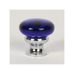 an image of a blue glass knob on a chrome plated cabinet door or drawer