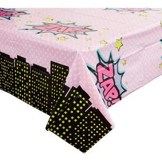 a table covered with pink and black polka doted paper, stars and letters on it