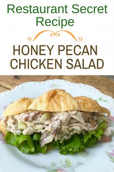 a chicken salad sandwich on a plate with the words honey pecan chicken salad above it