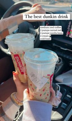 two people holding cups in their hands with the text, the best dunkin drink