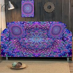 a couch covered in purple and blue designs