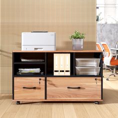 an office desk with drawers and printer on it