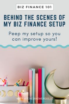 a desk with books and candles on it that says, behind the scenes of my biz finance setup pee my setup so you can improve yours