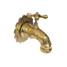 an antique brass faucet on a white background