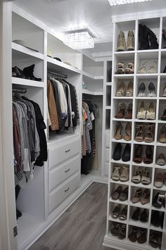 a walk in closet with white shelving and lots of shoes on the shelfs