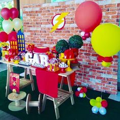 a table with balloons and decorations on it