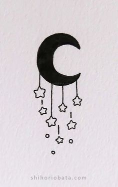 a drawing of a crescent and stars hanging from it's side