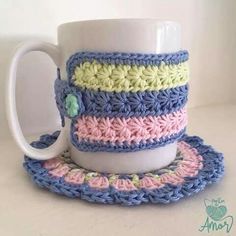 a crocheted coffee cup and saucer set