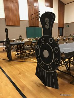 an empty room with tables and chairs in the center is decorated like a train track