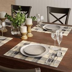 a table set with place settings for four