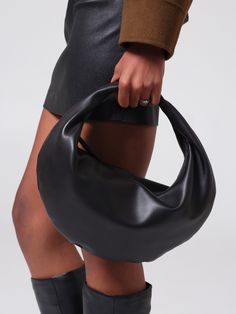 A slouchy leather hobo shoulder bag crafted from 100% Italian nappa leftovers, the Ring Bag is the perfect slouchy everyday bag. The clever click-ring design and 2 included straps quickly transform this bag from a handheld hobo purse to a curved shoulder bag to a crossbody leather crescent bag with a quick click. Versatile Evening Hobo Bag With Dust Bag, Modern Hobo Bag With Round Handle For Shopping, Modern Top Handle Hobo Bag With Dust Bag, Versatile Evening Handheld Hobo Bag, Evening Hobo Bag With Round Handle In Soft Leather, Chic Hobo Bag With Adjustable Strap And Round Handle, Trendy Hobo Bag With Detachable Round Handle, Trendy Evening Hobo Bag With Round Handle, Versatile Bucket Bag With Round Handle