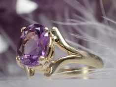 This beautiful little treasure features 1 lovely oval cut amethyst set in 10K yellow gold. Created by designer Badavici. The ring is in good pre-owned condition. It's a size 6.75 and weighs 1.75 grams. Please bear in mind this is a previously owned and loved vintage treasure which shows signs of wear. Please inspect all photos prior to purchase. Items $100 or more are shipped in a high end jewelry presentation gift box. Items less then $100 will be packaged very nicely in a pretty little box, ready for gift giving or just for safekeeping on your dresser. *INTERNATIONAL BUYER* Please be aware we can only track your package within the United States. Once your package reaches the destination country we have no control of tracking or delivery. We are not responsible for lost packages outside o Amethyst Set, Fabric Ribbon, Oval Cut, Amethyst Ring, Rings Statement, Vintage Designs, Statement Rings, Jewelry Rings, Amethyst