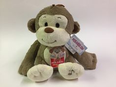 a brown teddy bear with a tag on it's chest and eyes, sitting against a white background