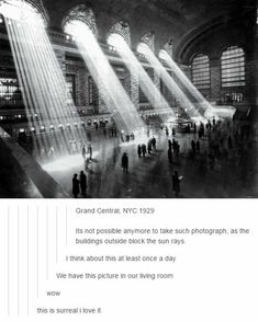 an image of people walking around in a building with beams of light coming from the ceiling