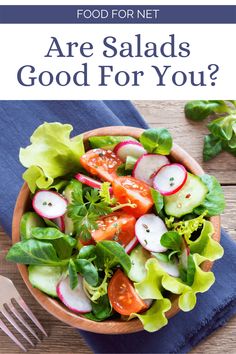 a salad with lettuce, radishes and carrots on it in a bowl