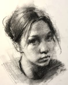 a pencil drawing of a woman's face with her hair pulled back and eyes closed