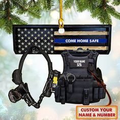 an ornament hanging from a christmas tree with the name home safe on it