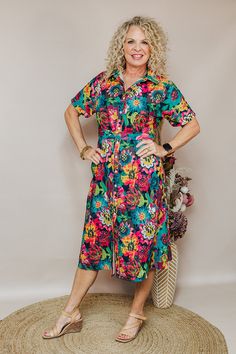 Dresses are a girl's best friend! The Vanessa Dress is a floral button-down midi dress in a floral print with a tie around the waist. Pair with heels or sneaker for whatever look your going for! Available in Sizes: X-Small, Small, Medium, Large, X-Large, 2X Michaelle is wearing a X-Small Fabric: 100% Polyester Fit: You Can Usually Size Down In Layerz Clothing Brand: Layerz Clothing Spring Tropical Print Midi Floral Dress, Spring Tropical Print Midi Dress For Day Out, Spring Midi Dress With Tropical Print For Day Out, Casual Floral Print Shirt Dress For Dress Down, Summer Floral Dress With Tie Waist For Garden Party, Spring Floral Print Shirt Dress, Vacation Floral Print Midi Shirt Dress, Floral Print Midi Shirt Dress For Daywear, Floral Print Shirt Dress For Spring