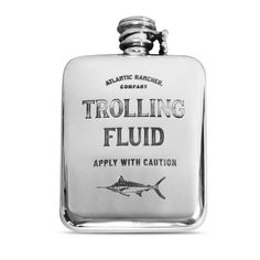 a flask with a fish on it and the words trolling fluid apply with caution