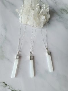 Pure and elegant selenite crystal necklace.  This cleansing pendant comes on a sterling silver cable chain that is available in 3 lengths. Wear this natural selenite pendant on its own or pair it up for that gorgeous layering look. The selenite crystal is not only beautiful but a translucent crystal that evokes energies of healing and protection. Selenite is a cleansing crystal that purifies, clears, and gives off positive energy. The soft white appearance of the stone is a perfect reflection of its gentle but highly effective energy, which emits white light and high vibrations. Free shipping within Canada is not tracked. If you would like tracked shipping, you can select at checkout for an additional amount. White Sterling Silver Pendant Crystal Necklace, White Sterling Silver Crystal Pendant Necklace, White Sterling Silver Crystal Necklace With Round Pendant, Spiritual White Crystal Round Pendant Necklaces, Spiritual White Crystal Round Pendant Necklace, White Moonstone Healing Necklaces, White Moonstone Pendant Crystal Necklace, White Minimalist Round Pendant Crystal Necklace, Minimalist White Round Pendant Crystal Necklace