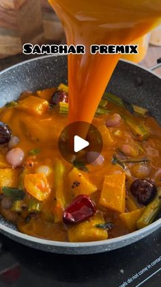 a pan filled with food and sauce being poured on top of the pot to make it