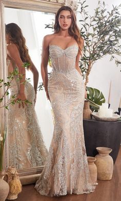 Nude fitted formal strapless sweetheart long dress with silver embellishment and sheer illusion bodice. Special Ocassion Dresses, Nude Gown, Corset Gown, Cinderella Divine, Strapless Prom Dress, Strapless Corset, Embellished Gown, Strapless Gown, Stunning Gowns