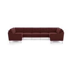 a large sectional couch with wooden legs and a dark red fabric upholstered on the back