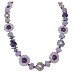 Beautiful stone necklace by Marina J. This lovely piece is made using multi shaped faceted Amethysts and Rose Quartz all adorned by 14k White Gold plated Silver Vermeil findings & Freshwater Grey Pearls which display a vivid sheen and iridescence. Due to their translucent and faceted nature, the Amethyst and Rose Quartz radiate great hues of color and sparkle when hit with light! Measuring 22 inches long, this necklace meets at a 14k White Gold Plated Silver Lobster Clasp, which perfectly accent Luxury Purple Necklace With Gemstone Beads, Luxury Amethyst Multi-stone Necklace, Luxury Multi-stone Amethyst Necklace, Formal Amethyst Gemstone Bead Necklace, Luxury Purple Jewelry With Natural Stones, Luxury Purple Jewelry With Round Beads, Luxury Purple Natural Stones Jewelry, Oval Purple Necklaces With Natural Stones, Luxury Amethyst Gemstone Beads Jewelry