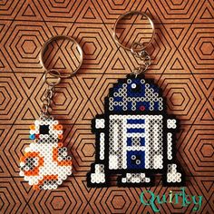 two keychains made to look like star wars characters