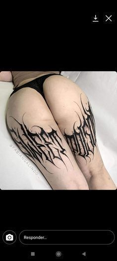 a woman's leg with tattoos on it and the words written in cursive writing