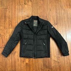 Designer- Prada Style- Moto Nylon Down Jacket Color- Black Size- 42, Runs Small And Fits Like A Small Or Xs, Measurements In Pics Color- Black Details- Signature Prada Triangle Logo On Left Shoulder. Zippered Pockets, Inner Zipper Pocket, Saffiano Leather Zip Pulls, Elastic Ruching Up The Sides To Give Extra Wiggle Room. Condition- Used, No Flaws To Note Fitted Black Waterproof Outerwear, Fitted Black Biker Jacket For Cold Weather, Sporty Winter Motorcycle Outerwear, Sporty Winter Motorcycling Outerwear, Black Moto Outerwear With Padded Collar, Functional Winter Biker Jacket For Motorcycling, Prada Style, Prada Jacket, Prada Triangle