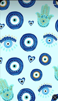 a blue and white wallpaper with an evil eye pattern