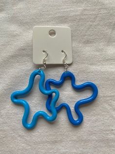 pair of blue earrings on white background