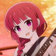 a girl with pink hair holding a guitar